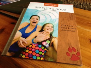 When you stay at a Great Wolf resort, you’ll find a card in your room with a special code.  After your stay you can visit www.shutterfly.com/greatwolf, enter the code and upload photos from your trip. Shutterfly lays them out in a Great Wolf Lodge themed photo book and sends it to you.
